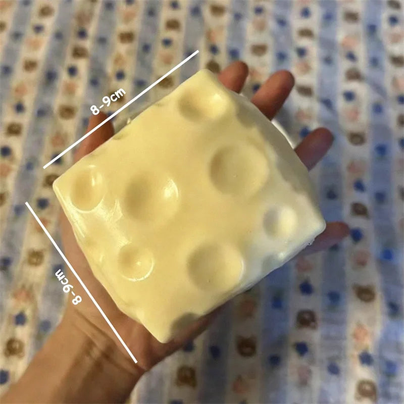 Jumbo Cheese Cube Stress Ball - Want a fun way to de-stress? This jumbo cheese stress ball is soft, squishy, and super satisfying to squeeze for calming ASMR vibes